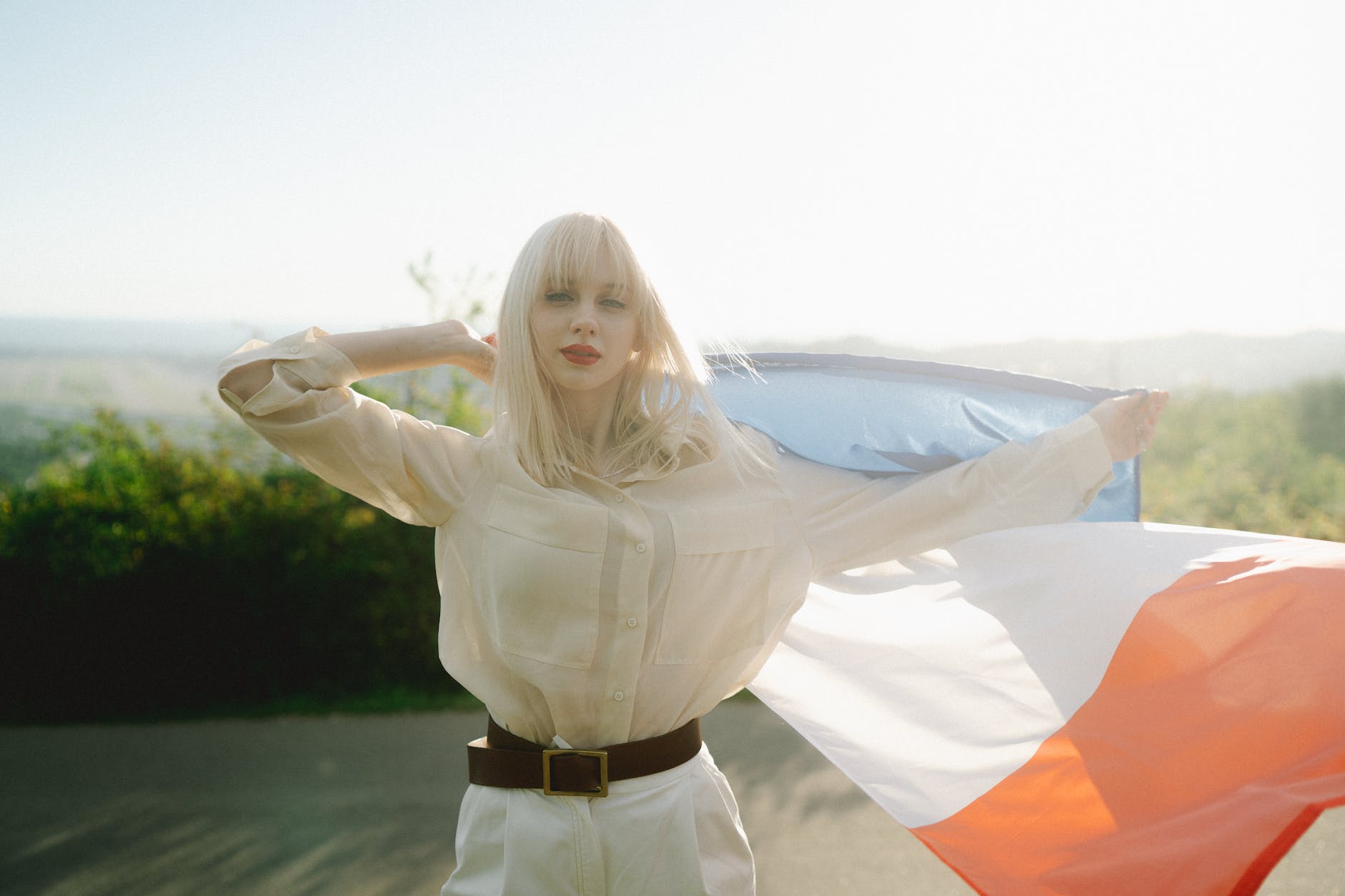 a woman holding a flag